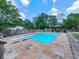 The backyard features a pool with diving board, stone patio, outdoor fireplace, and gazebo, perfect for relaxing and entertaining at 2347 Univeter Rd, Canton, GA 30115