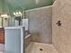 Bathroom features a walk-in shower with tile and glass enclosure at 2347 Univeter Rd, Canton, GA 30115