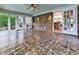 Sunroom featuring tile flooring and access to a brick-walled outside area at 2347 Univeter Rd, Canton, GA 30115