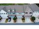 Aerial view of townhomes with garages and well-maintained landscaping at 360 Niles Ct, Marietta, GA 30060