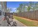 Outdoor patio with lawn, wooden fence, and chairs for outdoor lounging at 360 Niles Ct, Marietta, GA 30060
