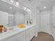 Bright bathroom with double vanity, white cabinets, and walk-in glass shower at 360 Niles Ct, Marietta, GA 30060