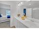 Bathroom featuring double vanity, white cabinets, a tiled walk-in shower, and bedroom access at 360 Niles Ct, Marietta, GA 30060