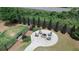Community dog park with seating area surrounding fire pit at 360 Niles Ct, Marietta, GA 30060