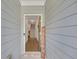 Inviting entryway with a wooden welcome sign, leading to hardwood floors and a staircase at 360 Niles Ct, Marietta, GA 30060