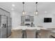 Well-appointed kitchen features stainless steel appliances, white subway tile backsplash, and an island with bar seating at 360 Niles Ct, Marietta, GA 30060