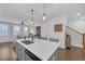 Open-concept kitchen boasts a large quartz island, stainless steel appliances, and seamless flow to living and dining areas at 360 Niles Ct, Marietta, GA 30060