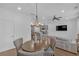 Open-concept layout with a view from the dining area to the living room and modern kitchen at 360 Niles Ct, Marietta, GA 30060