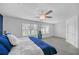 Bright main bedroom with a ceiling fan, carpeted floors, and a window overlooking a green landscape at 360 Niles Ct, Marietta, GA 30060