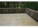 Spacious wooden back deck perfect for relaxing, entertaining, and enjoying scenic views at 553 Old Mill Ct, Norcross, GA 30093