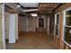 Spacious unfinished basement ready for customization, with exposed framework and natural light at 553 Old Mill Ct, Norcross, GA 30093
