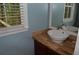 Bathroom showcasing a vessel sink, elegant countertop, and modern faucet with window views at 553 Old Mill Ct, Norcross, GA 30093