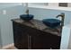 Stylish bathroom vanity with dual vessel sinks and modern fixtures enhance the space at 553 Old Mill Ct, Norcross, GA 30093