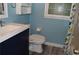 Well-lit bathroom featuring modern fixtures, including a sleek vanity and toilet with bidet attachment at 553 Old Mill Ct, Norcross, GA 30093
