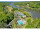 Community aerial view, showing the pool, tennis courts and boat launch on the Chattahoochee River at 9355 Huntcliff Trce, Sandy Springs, GA 30350
