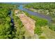 Community aerial view showcasing the horse stables, riding ring, and access to the Chattahoochee River at 9355 Huntcliff Trce, Sandy Springs, GA 30350