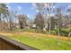 Expansive backyard view from deck, showcasing green lawn and privacy fence at 1095 Tucker Ave # 503, Atlanta, GA 30310