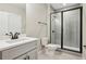 Modern bathroom with sleek vanity, gray tiled shower, and black hardware at 1095 Tucker Ave # 503, Atlanta, GA 30310