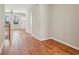 Spacious hallway with hardwood floors and natural light coming from the entry at 1095 Tucker Ave # 503, Atlanta, GA 30310