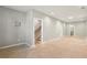 Open-concept living area showcasing stairs and neutral tones at 1095 Tucker Ave # 503, Atlanta, GA 30310