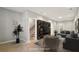 A cozy living room features a gray couch, a round table, and a large entertainment center with shelves at 1095 Tucker Ave # 503, Atlanta, GA 30310