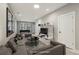 A cozy living room features a gray couch, a round table, and a large entertainment center at 1095 Tucker Ave # 503, Atlanta, GA 30310