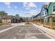 Street view of colorful townhomes with dedicated parking spaces in front at 1095 Tucker Ave # 503, Atlanta, GA 30310