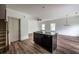 Bright, open-concept kitchen featuring an island with a sink and a sleek countertop in a modern home at 1800 Forkview Ct, Lawrenceville, GA 30044