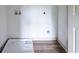 Well-lit laundry room with durable floor and convenient hookups for appliances at 1800 Forkview Ct, Lawrenceville, GA 30044