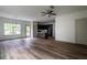 Open-concept living space with hardwood floors, dark kitchen cabinets and plenty of natural light at 1800 Forkview Ct, Lawrenceville, GA 30044