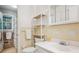 Bright bathroom featuring a toilet, shelving, mirror and sink at 3501 Montreal Way, Tucker, GA 30084
