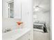 Bright bathroom featuring a white vanity and a view into the adjacent bedroom at 3501 Montreal Way, Tucker, GA 30084