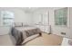 Bedroom with two windows, neutral carpet, and large dresser with mirrors at 3501 Montreal Way, Tucker, GA 30084