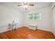 Bedroom featuring hardwood floors and a comfortable sitting area at 3501 Montreal Way, Tucker, GA 30084