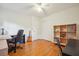 Office features hardwood floors, desk and book shelves at 3501 Montreal Way, Tucker, GA 30084