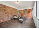 Covered porch with brick floors and walls, offering an inviting outdoor space at 3501 Montreal Way, Tucker, GA 30084