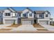 Charming townhomes with stone accents, a garage, and manicured front yards create a welcoming curb appeal at 4948 Jatoba Rd, Acworth, GA 30101