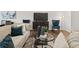 Cozy living room with a comfortable sofa, modern decor, and ample natural light at 4948 Jatoba Rd, Acworth, GA 30101