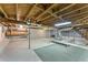 Unfinished basement showcasing exposed beams, concrete floors, and ample storage space at 618 Buchanan Hwy, Dallas, GA 30157
