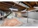 Unfinished basement featuring an open layout, concrete floors, and wood stairs at 618 Buchanan Hwy, Dallas, GA 30157
