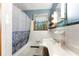 Classic bathroom with tiled walls, a decorative shower curtain, and a marble-look countertop at 618 Buchanan Hwy, Dallas, GA 30157