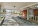 Spacious carport featuring metal supports, brick and tile entryway, and a ceiling fan at 618 Buchanan Hwy, Dallas, GA 30157