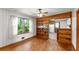 Dining room features hardwood floors, a built-in bookcase, and bright natural light at 618 Buchanan Hwy, Dallas, GA 30157