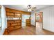 Dining room features hardwood floors, a built-in bookcase, and bright natural light at 618 Buchanan Hwy, Dallas, GA 30157