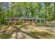 Charming single-story brick home with a spacious carport and mature trees at 618 Buchanan Hwy, Dallas, GA 30157