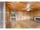 Living room features wood-paneled walls, hardwood floors, and a fireplace at 618 Buchanan Hwy, Dallas, GA 30157