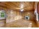 Living room features wood-paneled walls, hardwood floors, and fireplace at 618 Buchanan Hwy, Dallas, GA 30157