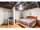 Finished basement bedroom with laminate floors, drop ceiling, and comfortable decor at 7840 Highway 101, Rockmart, GA 30153