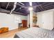 This bedroom features wood floors, a ceiling fan and exposed duct work adding an industrial aesthetic at 7840 Highway 101, Rockmart, GA 30153