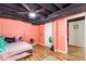 Comfortable bedroom features wood floors and exposed ceiling at 7840 Highway 101, Rockmart, GA 30153